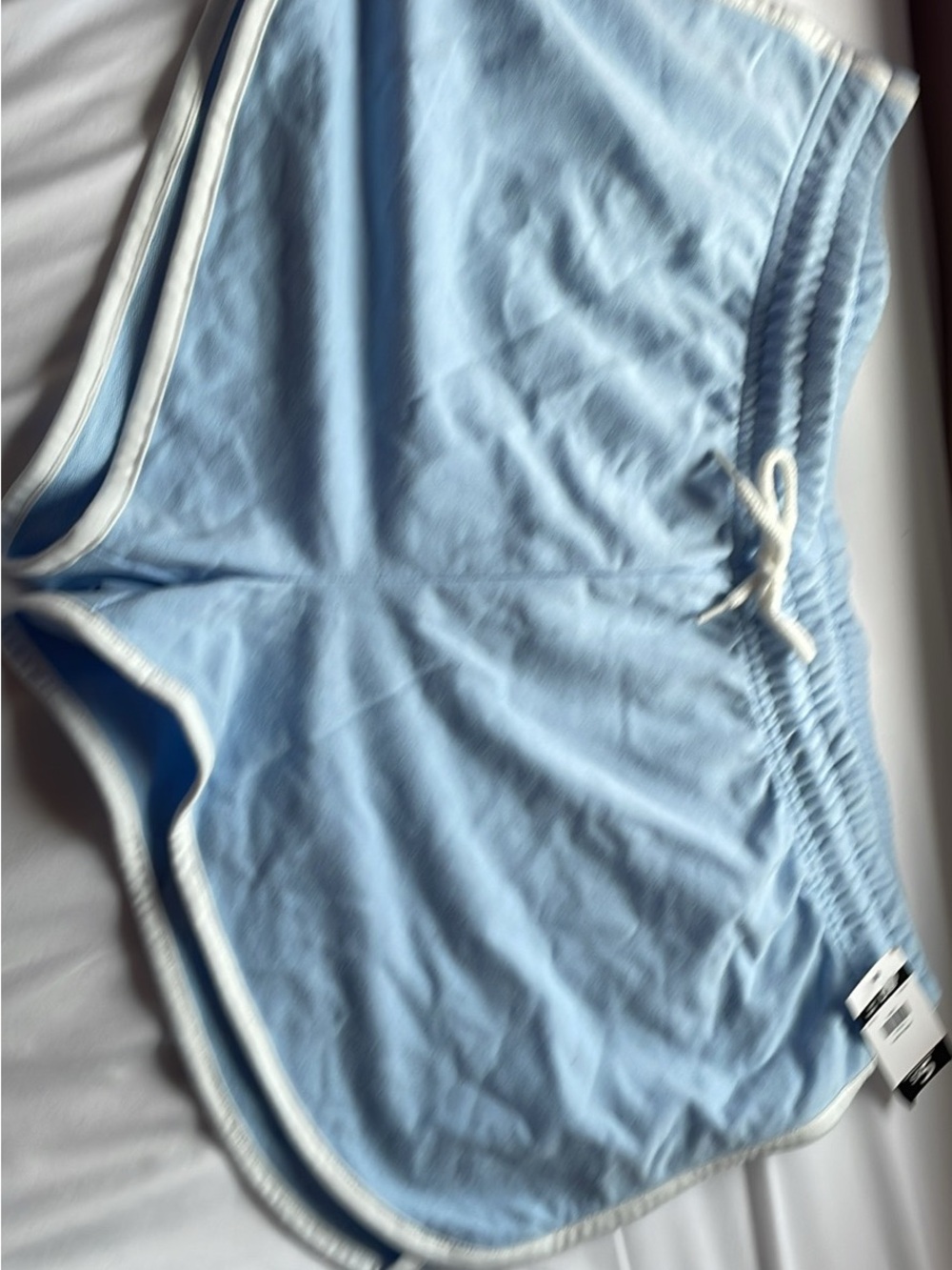 Light Blue Athletic Shorts with White Trim